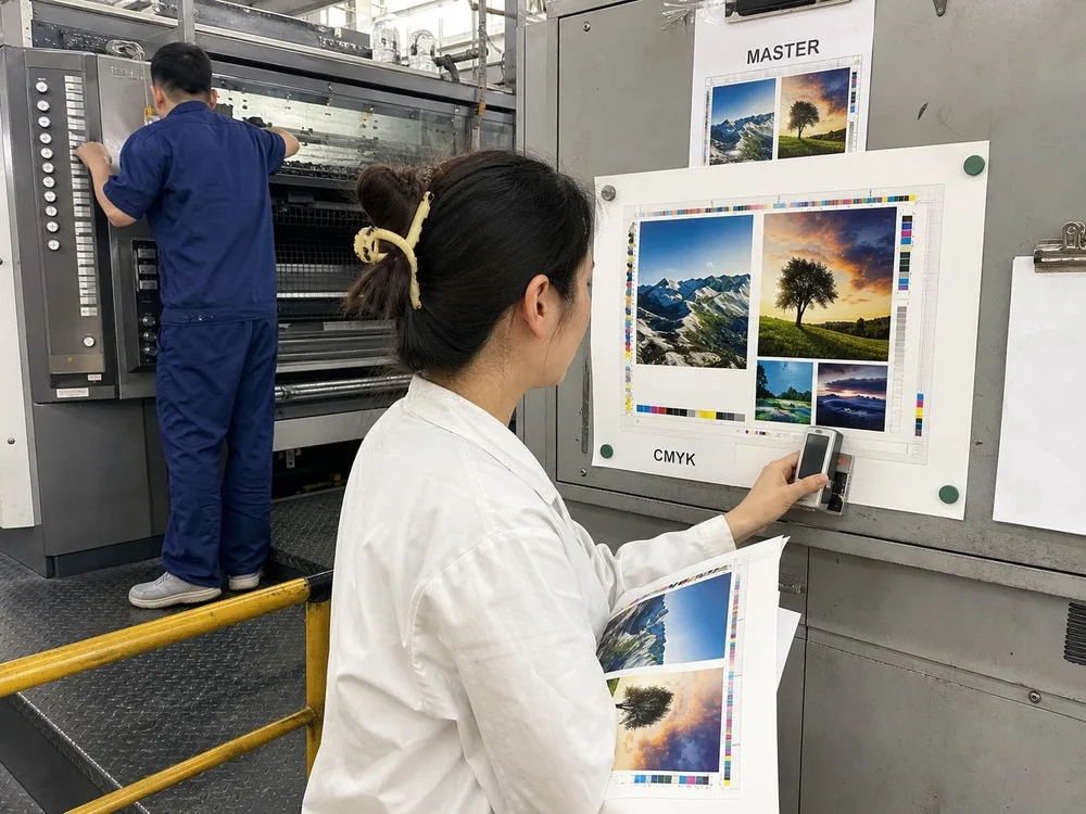 qc staff comparing sheets color standard
