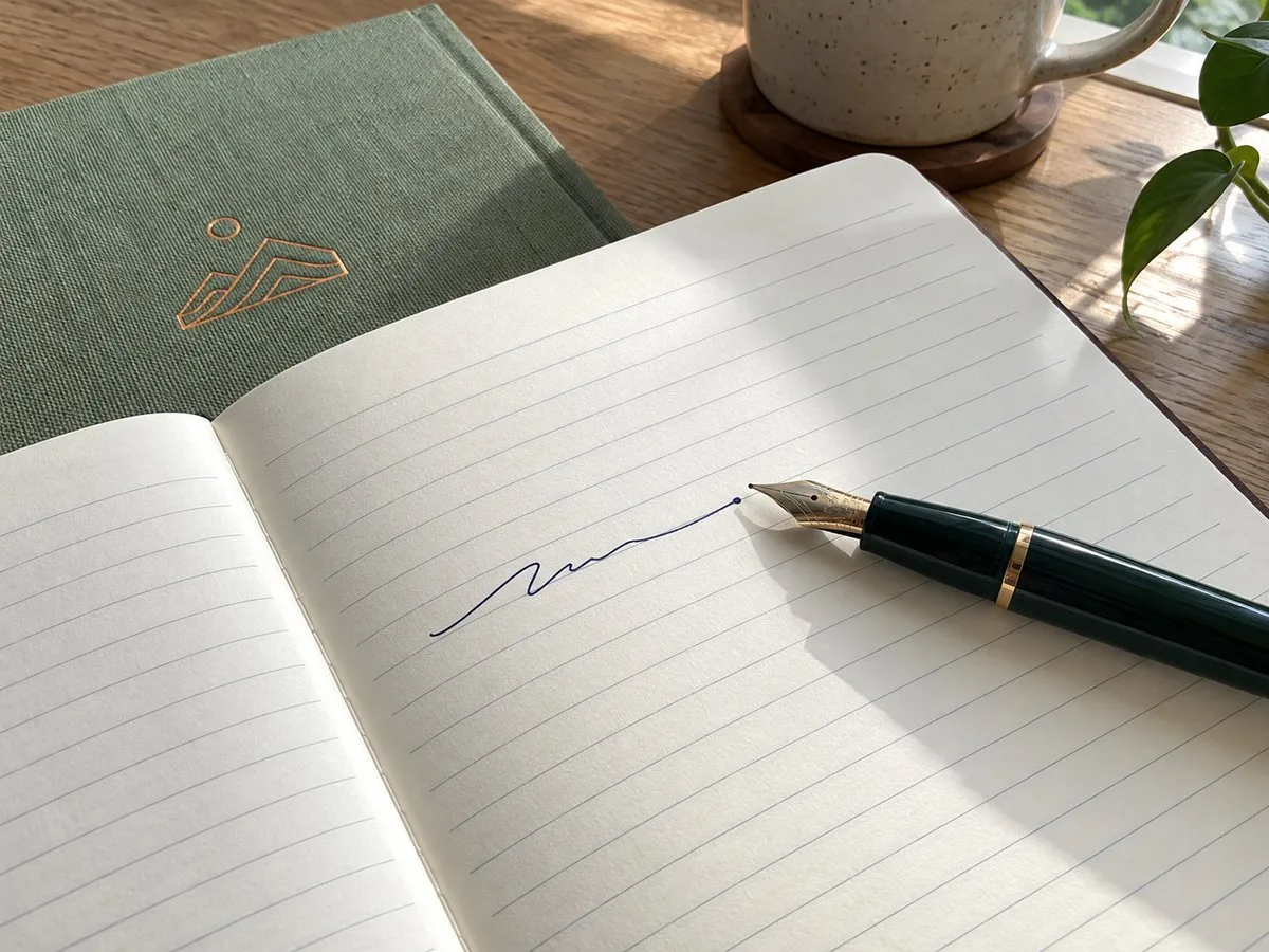 close-up of ruled lined notebook page with pen